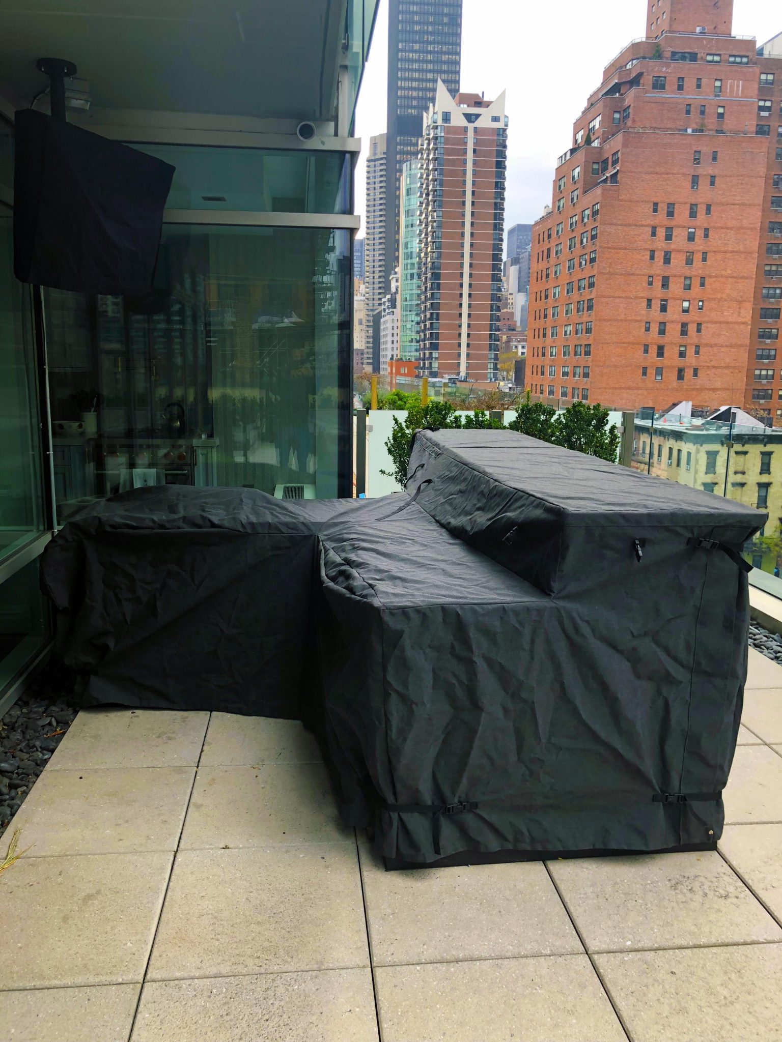 nyc outside deck with covered outside island