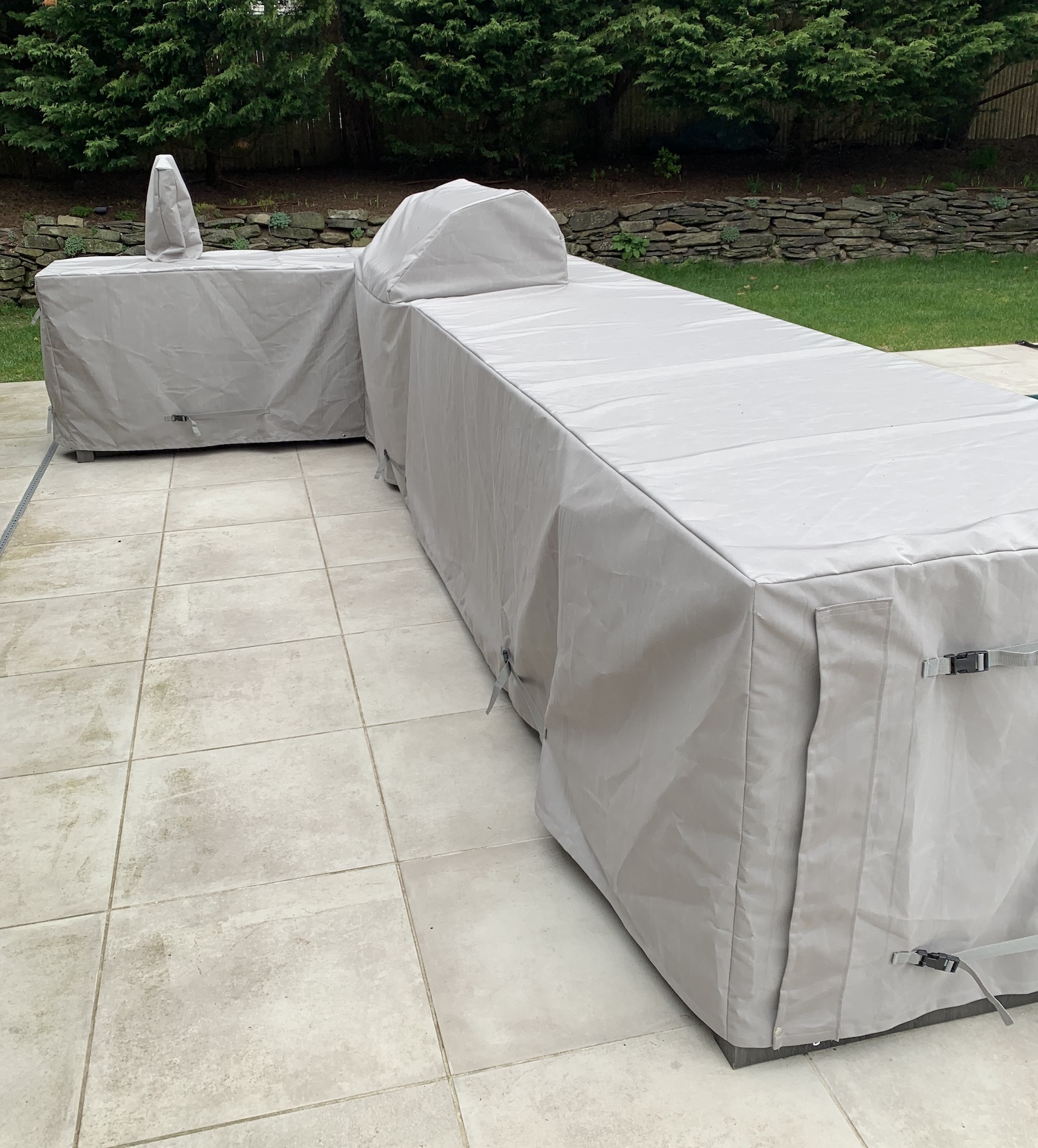 L-Shaped outdoor grill with custom fabric cover