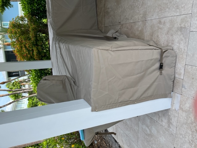 L-Shaped grill with beige fabric cover