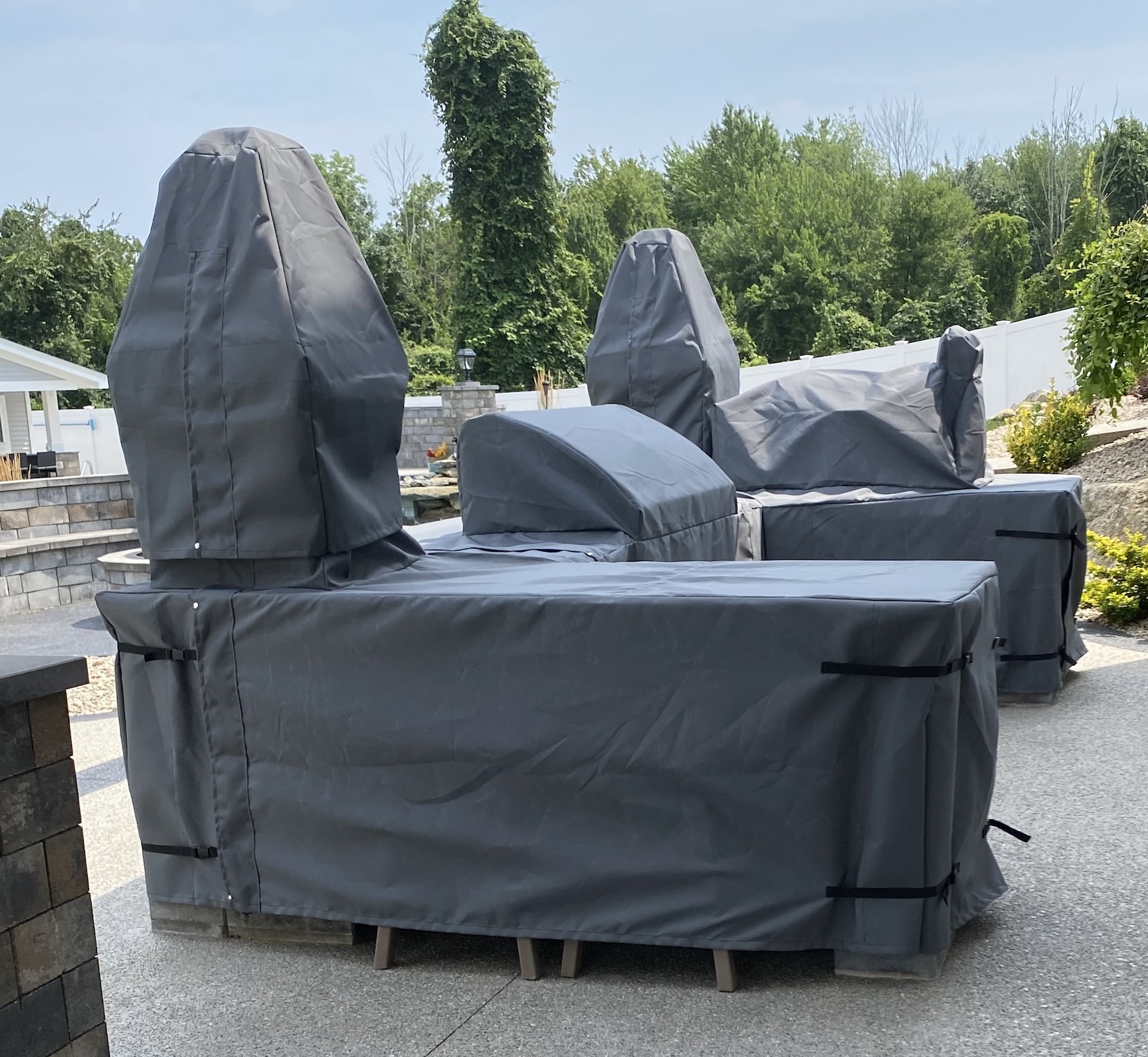 L-Shaped outdoor patio section with grill built in with covers