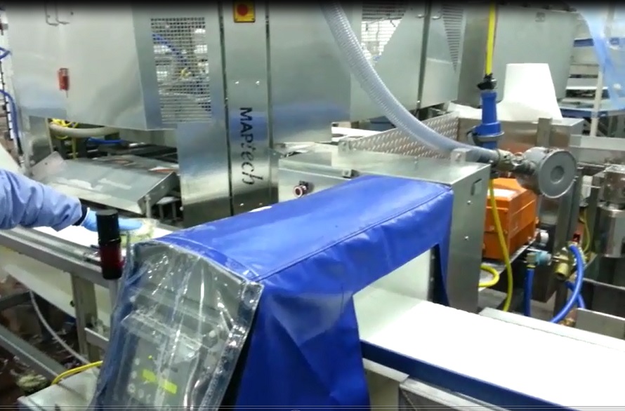 Custom cover on manufacturing equipment