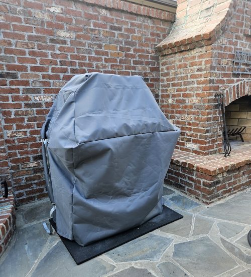 Outdoor grill with fabric cover